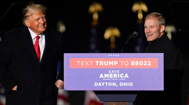 FILE - Former President Donald Trump welcomes Rep. Jim Jordan, R-Ohio, to the stage at a campaign rally in support of the campaign of Ohio Senate candidate JD Vance at Wright Bros. Aero Inc. at Dayton International Airport on Monday, Nov. 7, 2022, in Vandalia, Ohio. (AP Photo/Michael Conroy, File)
