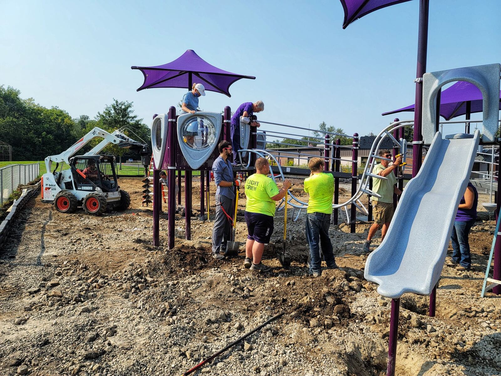 The playground at Amanda Elementary School on Oxford-State Road nears completion on Monday after four days of work from Middletown Kiwanis members and community volunteers. NICK GRAHAM/STAFF