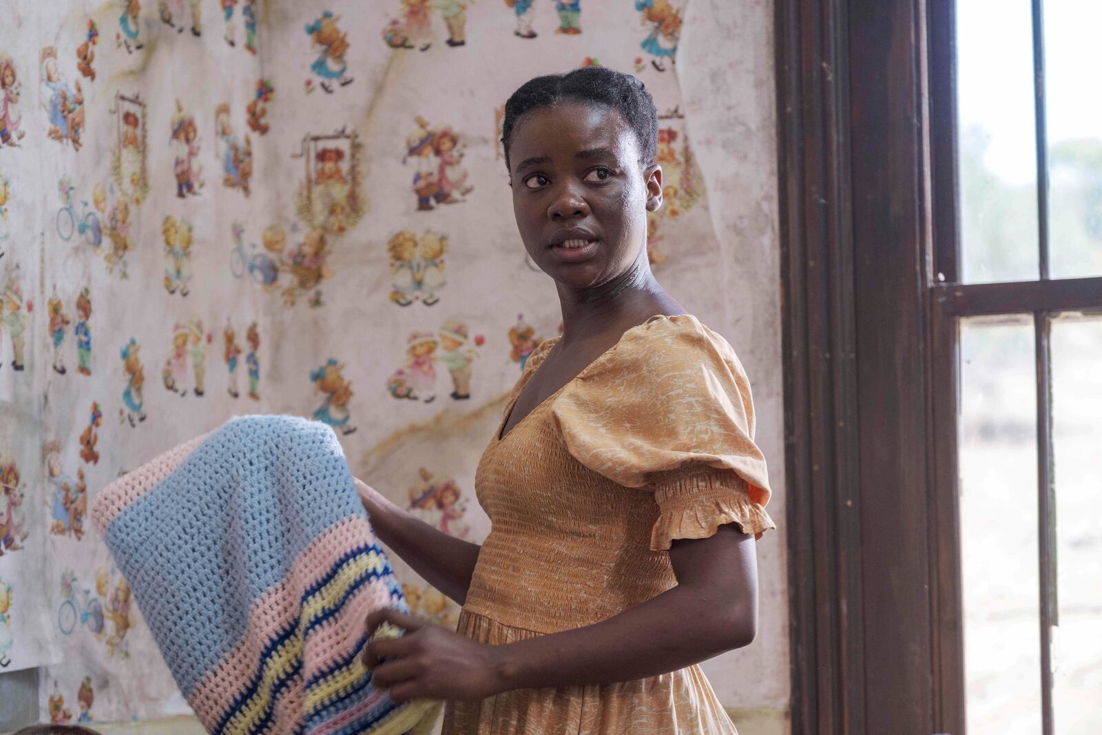 This image released by Sony Pictures Classics shows Zikhona Bali in a scene from "Don’t Let’s Go to the Dogs Tonight." (Coco Van Oppens/Sony Pictures Classics via AP)
