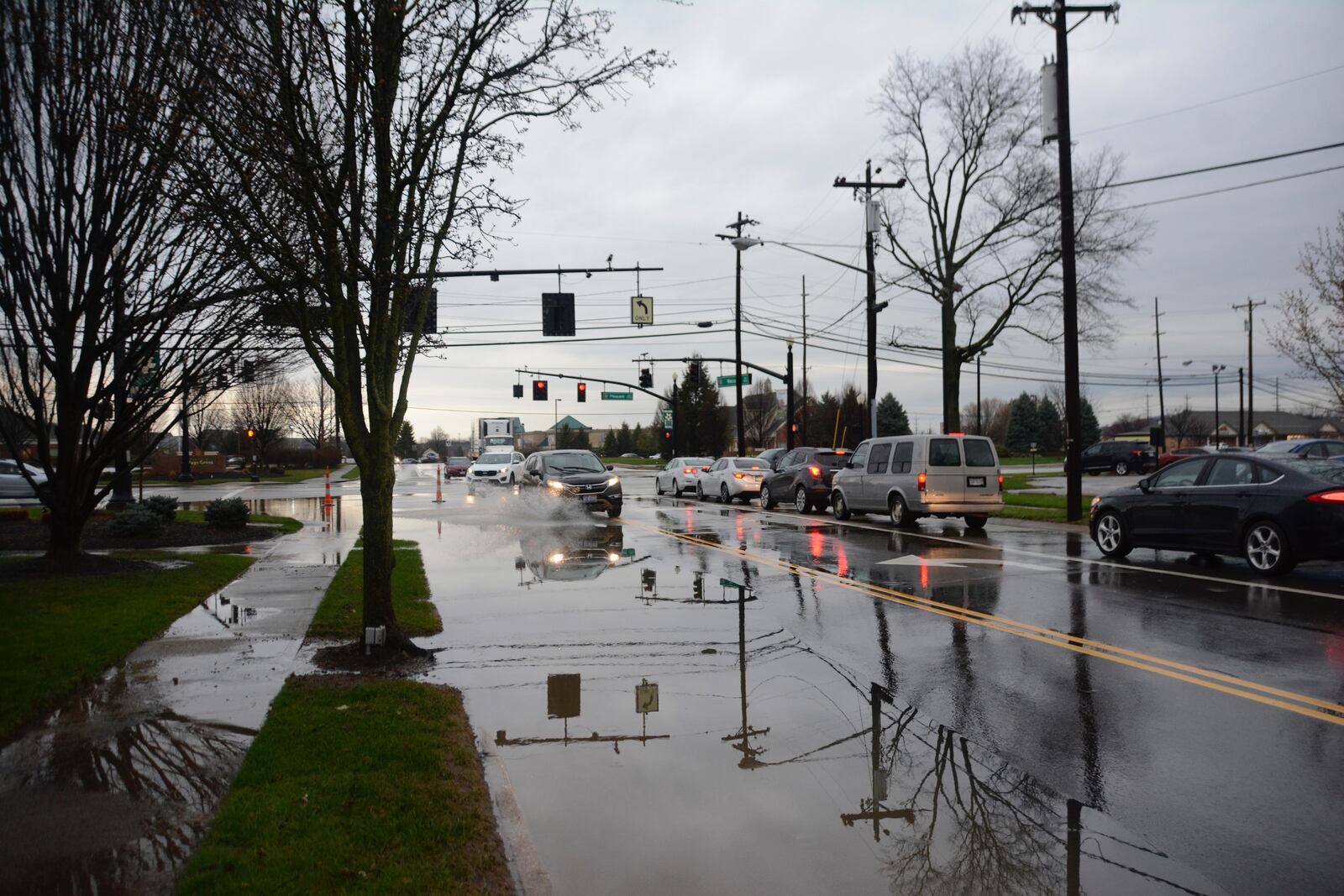 Tuesday morning, April 3, 2018, rains lead to some flooding around Butler County, including on Wessel Drive at Pleasant Avenue in Fairfield where the catch basins couldn't keep up with the amount of rain water that fell.