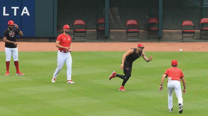 Reds outfielder Nick Castellanos participates in the first workout of Summer Camp on Friday, July 3, 2020, at Great American Ball Park in Cincinnati. David Jablonski/Staff