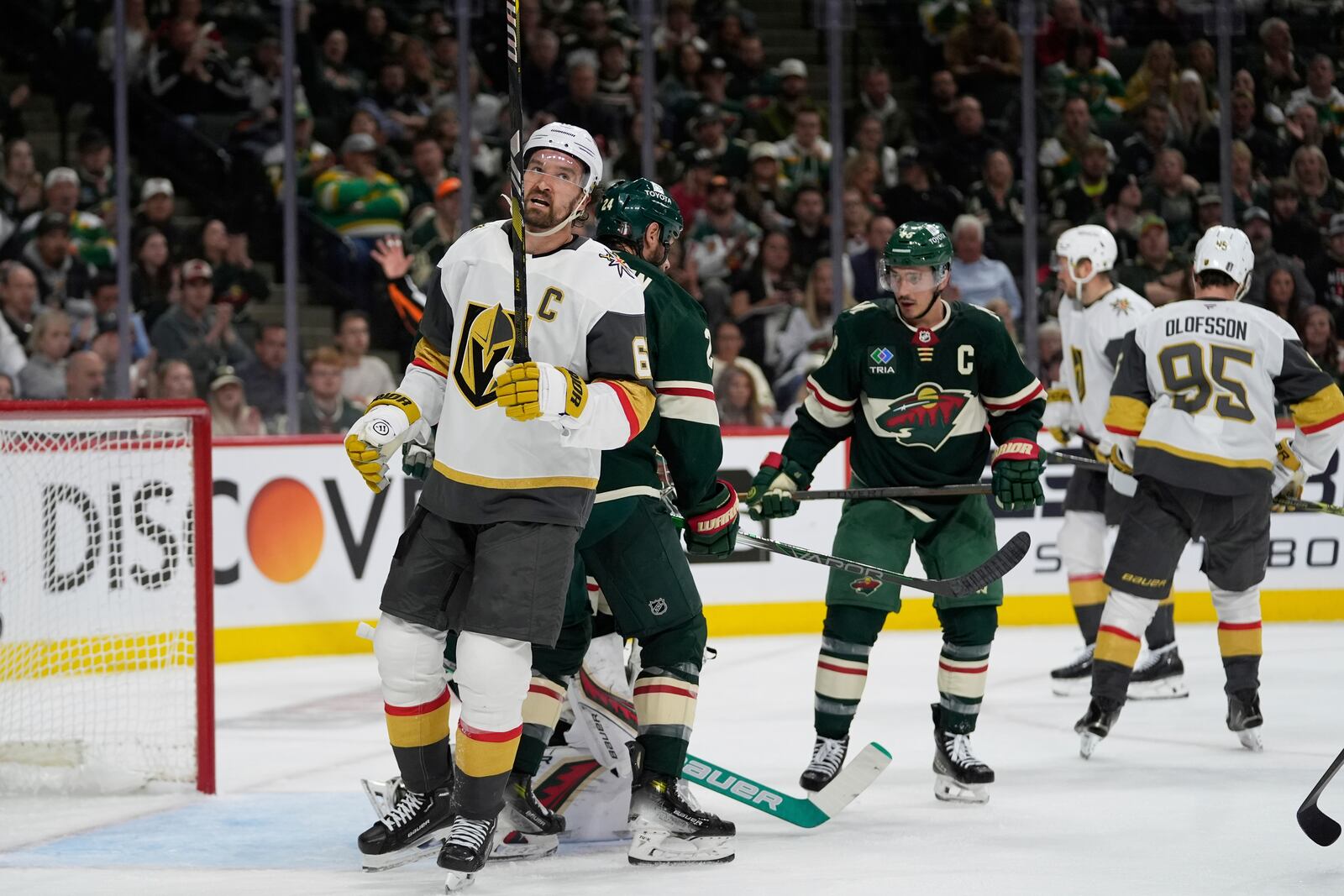 Vegas Golden Knights right wing Mark Stone, left, stands on the ice after a stop by Minnesota Wild goaltender Filip Gustavsson (obscured) during the second period of Game 3 of a first-round NHL hockey playoff series Thursday, April 24, 2025, in St. Paul, Minn. (AP Photo/Abbie Parr)