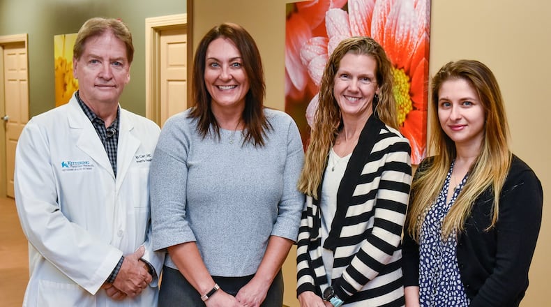 Phillip Carr (from left), Kelly Cole, Beverly Alten and Anna Parizh are physicians at Kettering Physician Network Women’s Health Hamilton across from Fort Hamilton Hospital in Hamilton. Alten and Parizh recently joined the practice to add resources to the Hamilton office.