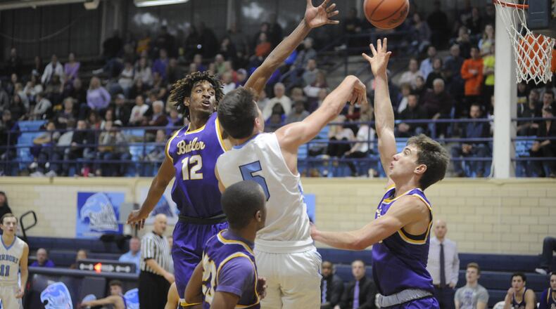 Butler players Bryant Johnson (left) and Michael Kreill (right) defend a shot. MARC PENDLETON / STAFF