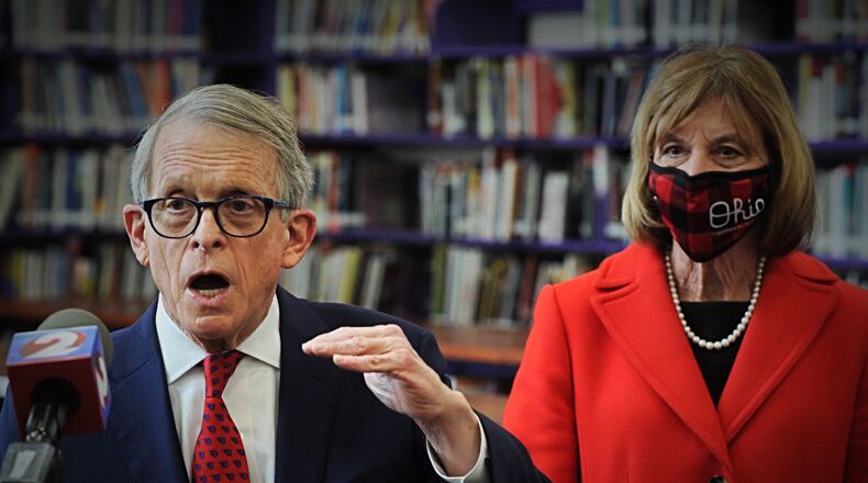 Gov. Mike DeWine addresses the media after touring a COVID-19 vaccination clinic at Thurgood Marshall High school in Dayton. / Staff photo by Marshall Gorby