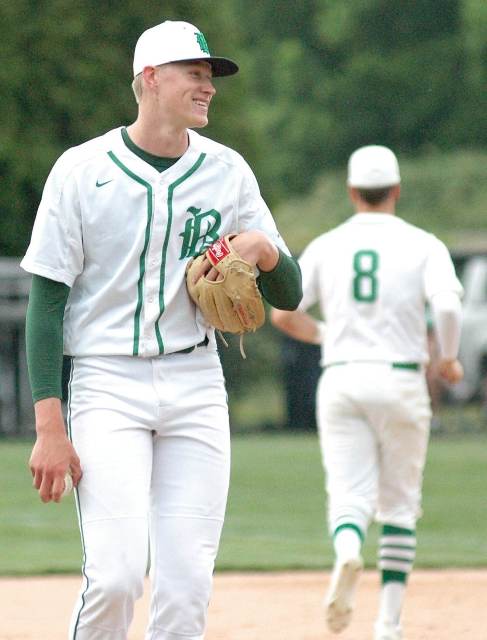 Badin pitcher Chase Hopewell cracks a smile between innings Thursday during a Division I sectional baseball game against visiting Oak Hills at Alumni Field in Joyce Park. Badin won 11-0 in five innings. RICK CASSANO/STAFF