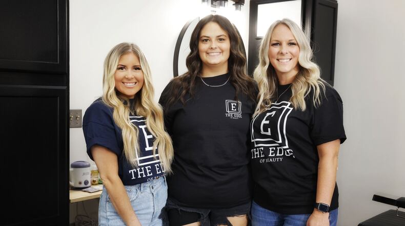 Erin Hubbard, right, has opened The Edge of Beauty salon on E. State Street in Trenton. Cassidy Harris, left, will join her and Hubbard's daughter, Jillian Valerio, middle, will join the team after finishing cosmetology school next month. NICK GRAHAM/STAFF