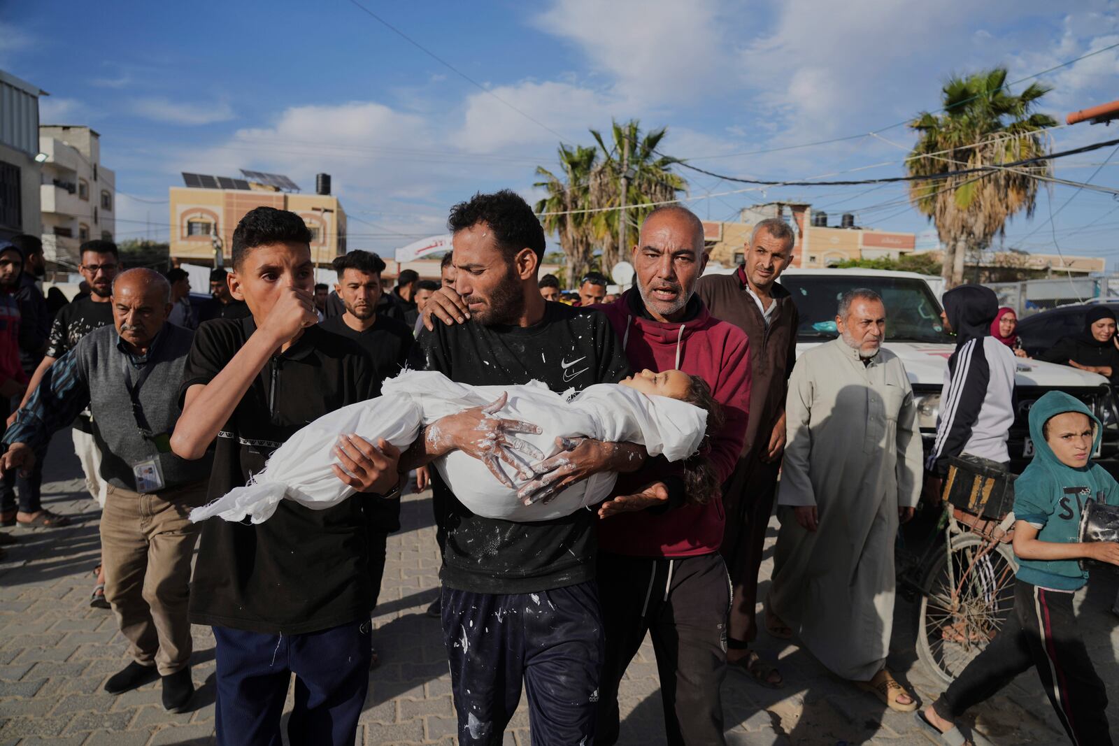 Relatives of Palestinian child, Massa Abed, 4, who was killed in an Israeli army airstrike on the Gaza Strip, carry her body at Al-Aqsa Hospital in Deir al-Balah, Gaza, Sunday, April 27, 2025. (AP Photo/Abdel Kareem Hana)