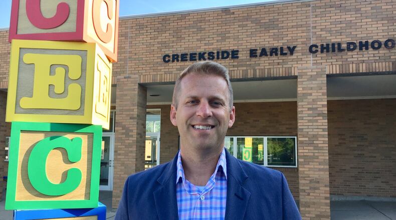 Former Creekside Early Childhood Center school Principal Brad Lovell is a rarity among area school officials for now holding a seat on the governing school board of the district he used to work for. Lovell says his experience as a school building leader has helped him in his first publicly elected office. (Photo by Michael D. Clark/Journal-News)
