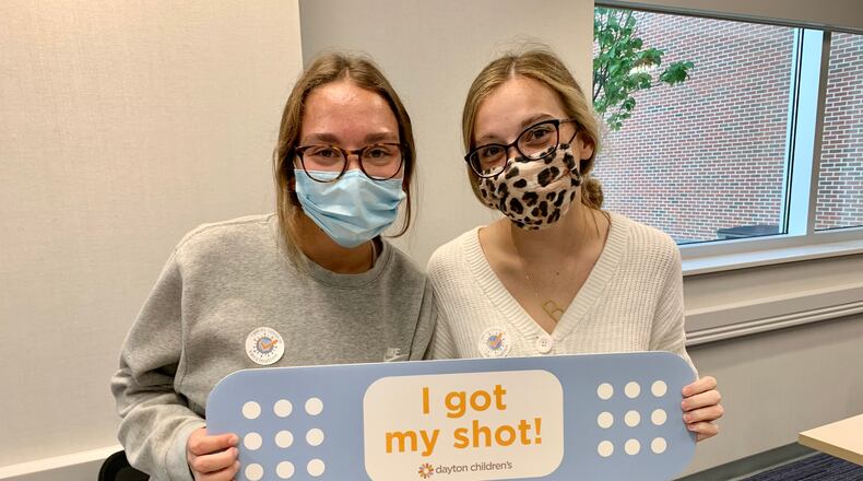 Kaylee Campbell and Brooklyn Cotton are 15-year-old best friends at Miamisburg High School. They got their coronavirus vaccines at Dayton Children's Hospital on Wednesday Sept. 1 so they hopefully will not miss homecoming again like they did last year.