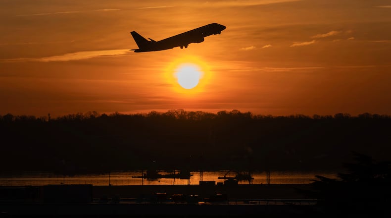 FILE - An airplane lifts off from Ronald Reagan Washington National Airport as the sun rises Feb. 3, 2025, in Arlington, Va. (AP Photo/Jose Luis Magana, File)