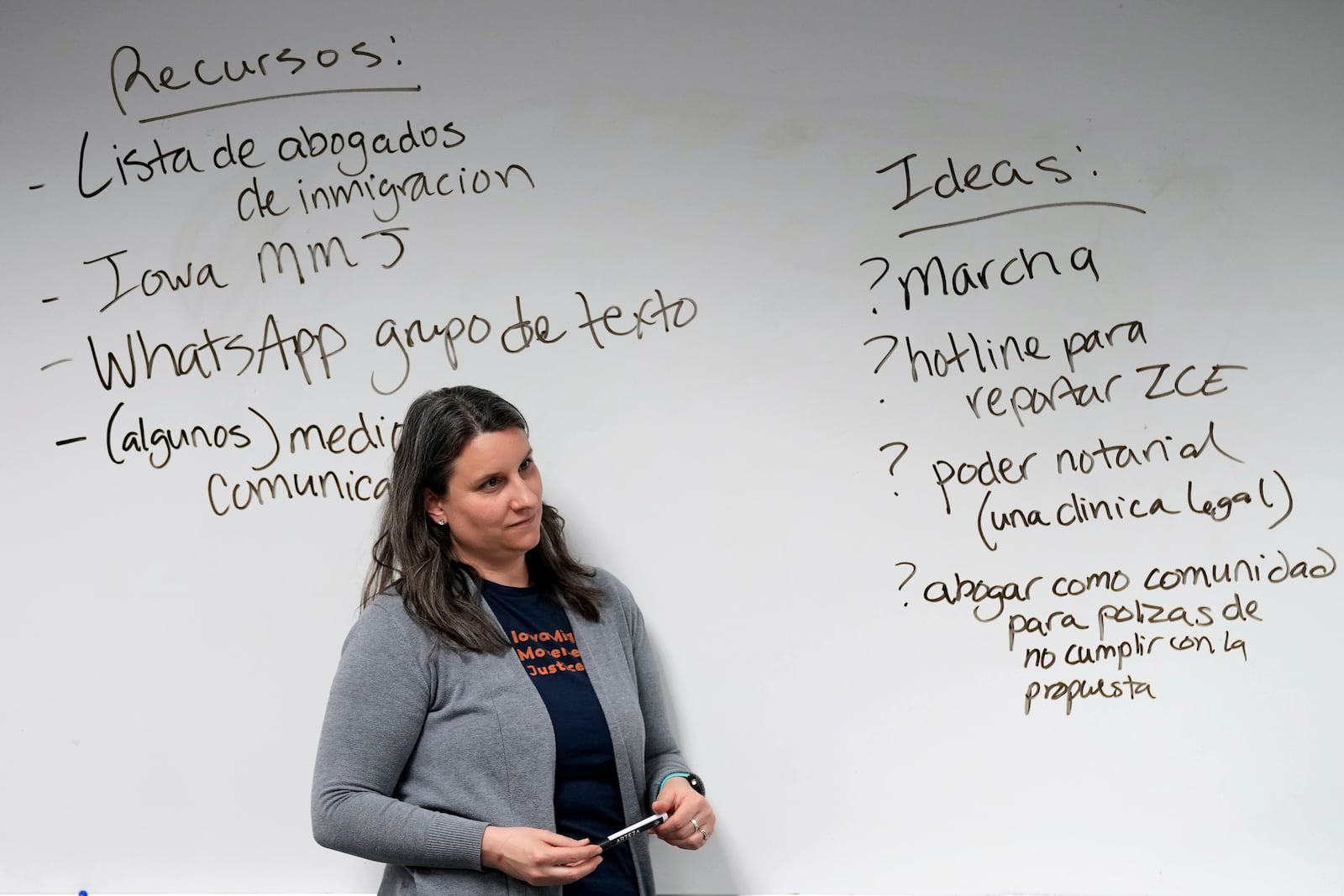 FILE - Executive Director Erica Johnson listens to an audience member's question during an Iowa Migrant Movement for Justice informational meeting, Wednesday, March 27, 2024, in Des Moines, Iowa. (AP Photo/Charlie Neibergall, File)
