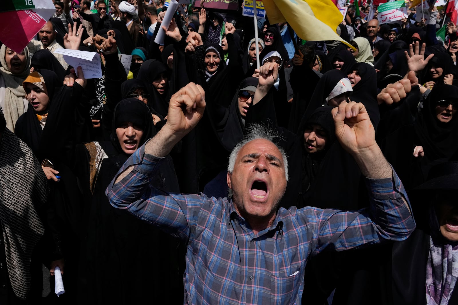 Iranian protesters chant slogans during a protest to condemn Israeli attacks on multiple cities across Iran, after the Friday prayers ceremony in Tehran, Iran, Friday, June 20, 2025. (AP Photo/Vahid Salemi)