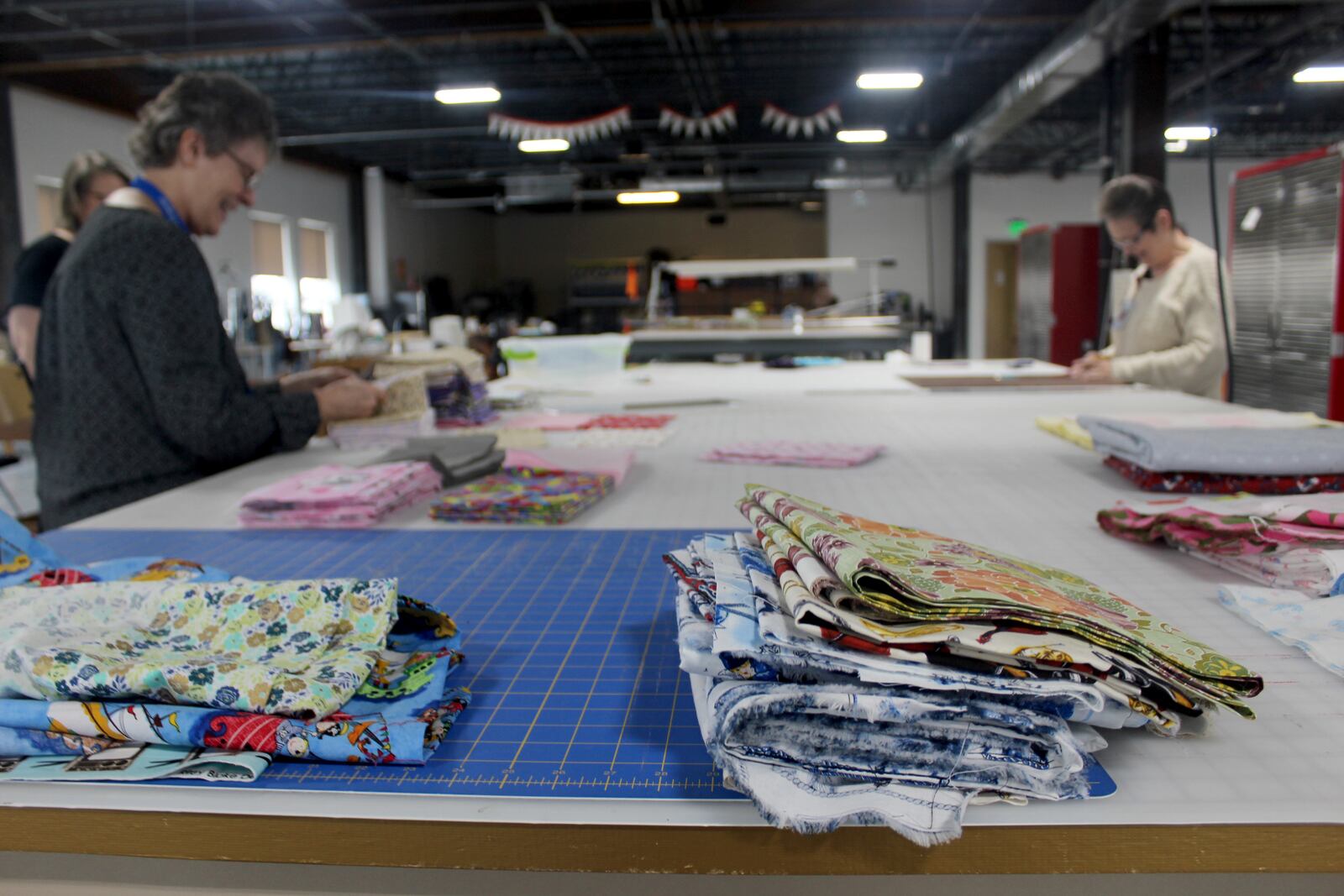 Since Friday, March  20,  Dayton Sewing Collaborative volunteers  in homes around  the community have made hundreds of  reusable face mask for local organization who need them as worries mount of the  coronavirus.  Volunteers Tursia Turner (right)  and Bonnie Craigo are pictured.