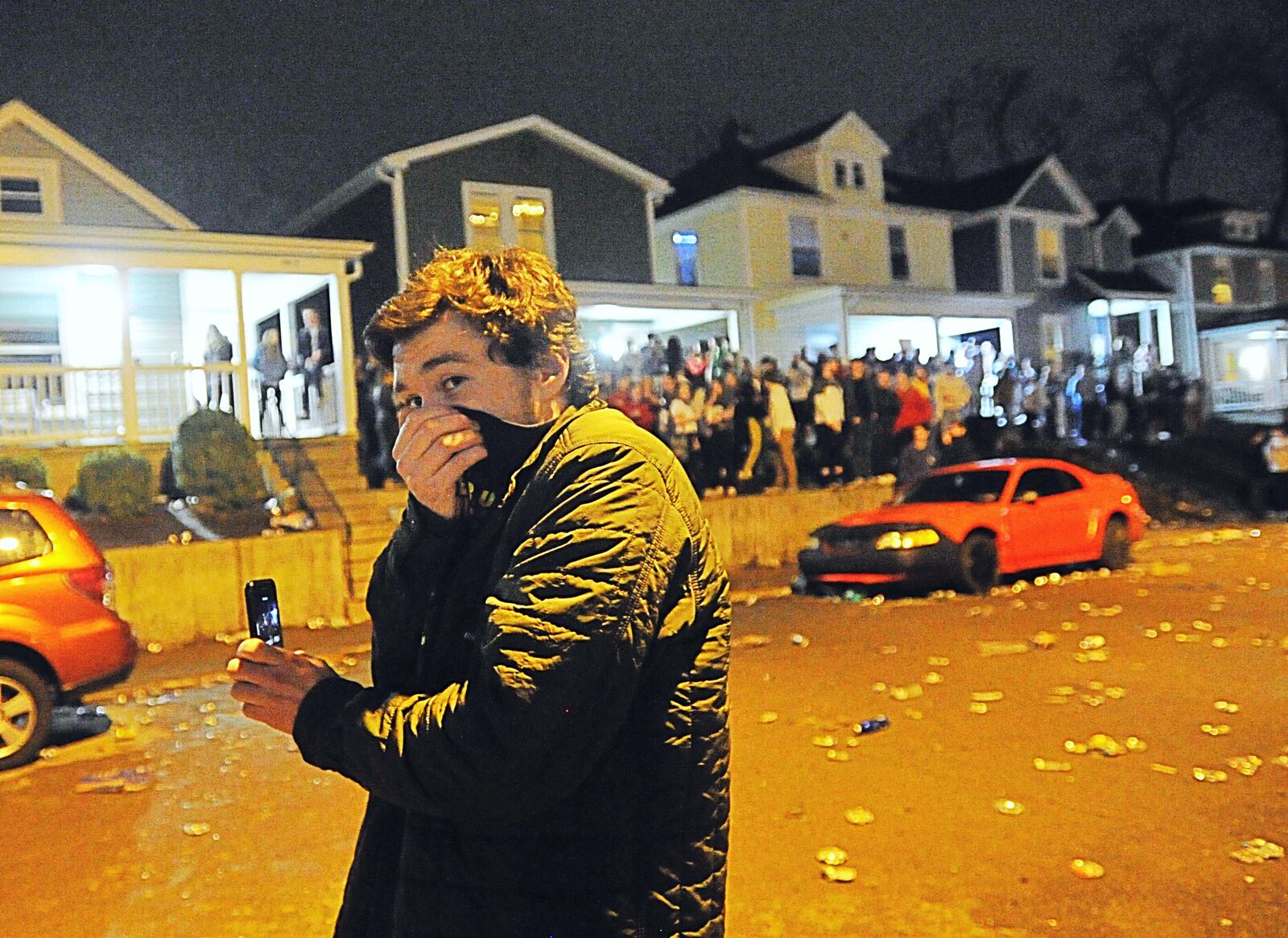 Police respond to the University of Dayton campus on Lowes Street on a report of a large crowd.   UD says more than 1,000 students gathered on Lowes Street in the South Student Neighborhood Tuesday night in reaction to housing closing Wednesday, March 11, 2020 for most students due to the spread of the coronavirus.  Police launched pepper balls, which contain powder with an irritant that disperses quickly, that were unsuccessful in reducing the crowd size  Officials say at least one person was reportedly injured by a thrown bottle.   Staff photo by Marshall Gorby.
