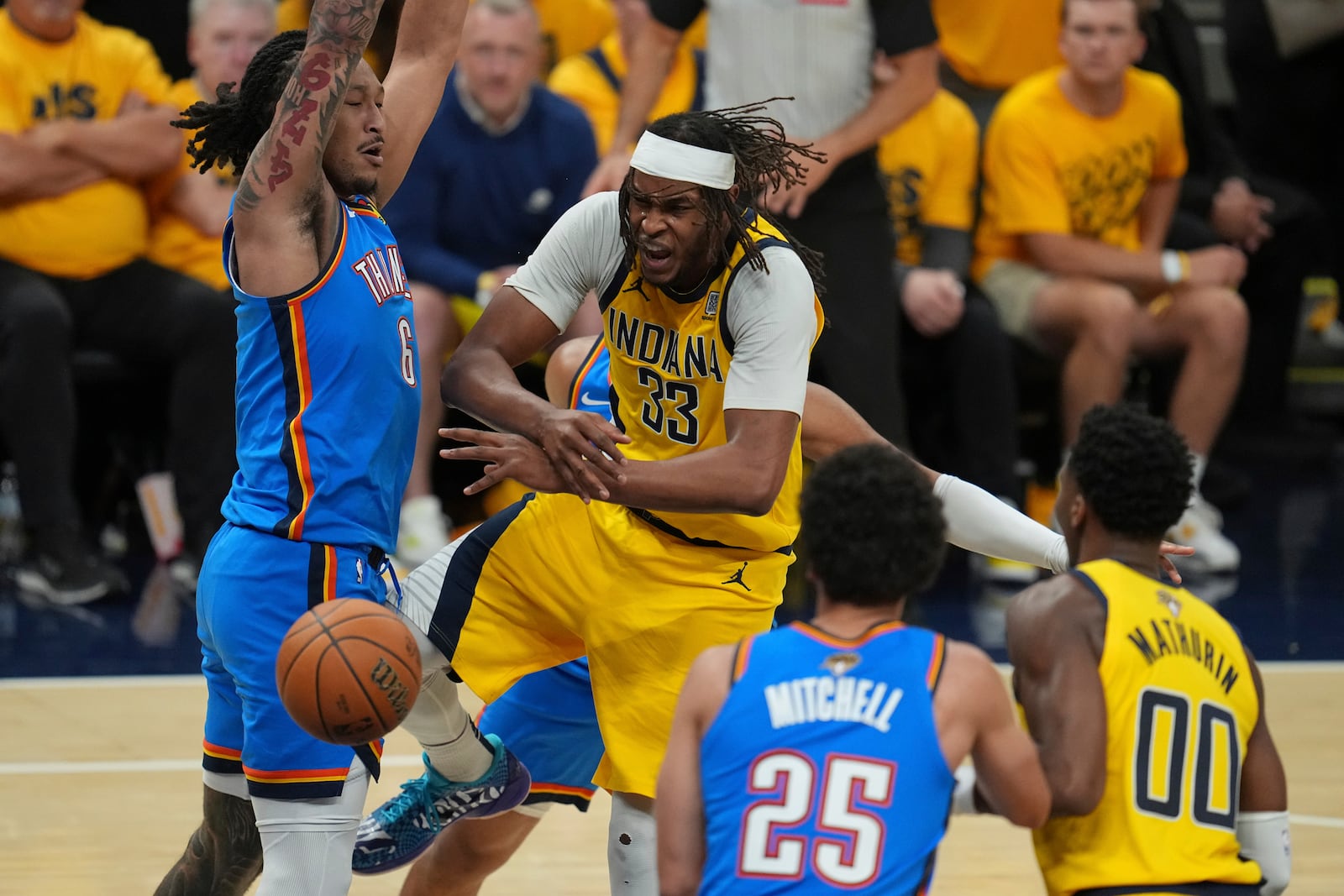 Indiana Pacers center Myles Turner (33) loses the ball as Oklahoma City Thunder forward Jaylin Williams (6) defends during the second half of Game 6 of the NBA Finals basketball series, Thursday, June 19, 2025, in Indianapolis. (AP Photo/Michael Conroy)