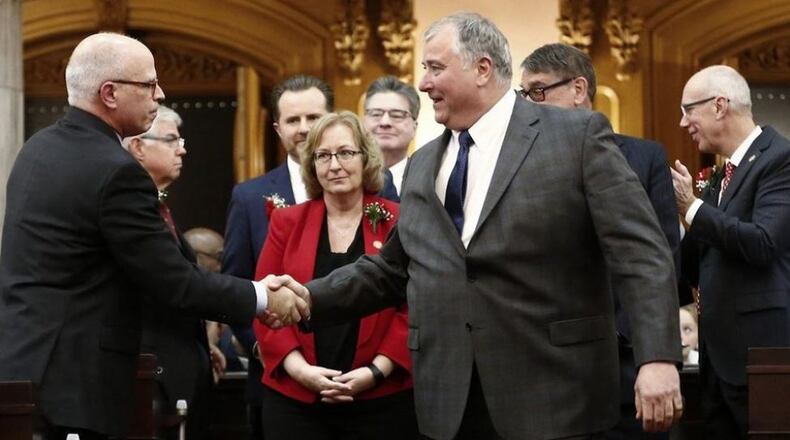 Rep. Larry Householder, center, is congratulated Monday, Jan. 7, 2019, after he was elected as the new Speaker of the Ohio House. He and previous Speaker Ryan Smith, not pictured, battled for the position for months. FRED SQUILLANTE/THE COLUMBUS DISPATCH