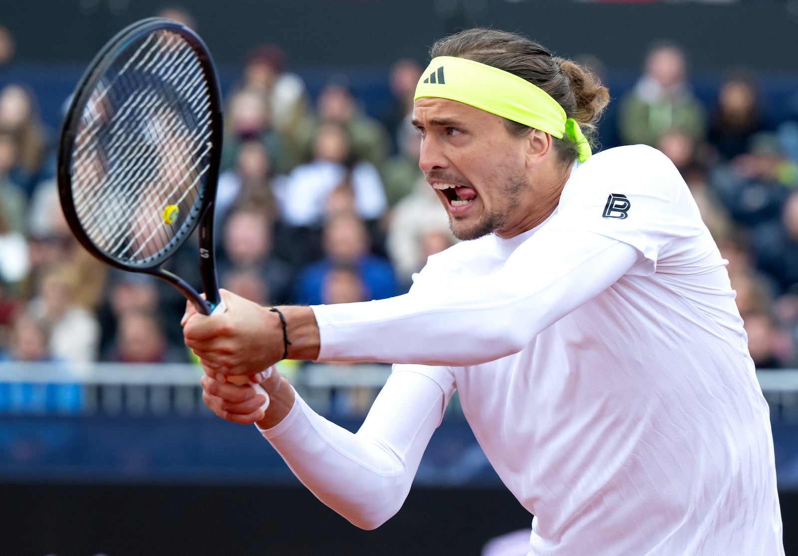 Germany's Alexander Zverev returns a ball to Netherlands' Tallon Griekspoor, during the men's singles quarterfinal match at the Munich tennis tournament, in Munich, Germany, Friday April 18, 2025. (Sven Hoppe/dpa via AP)