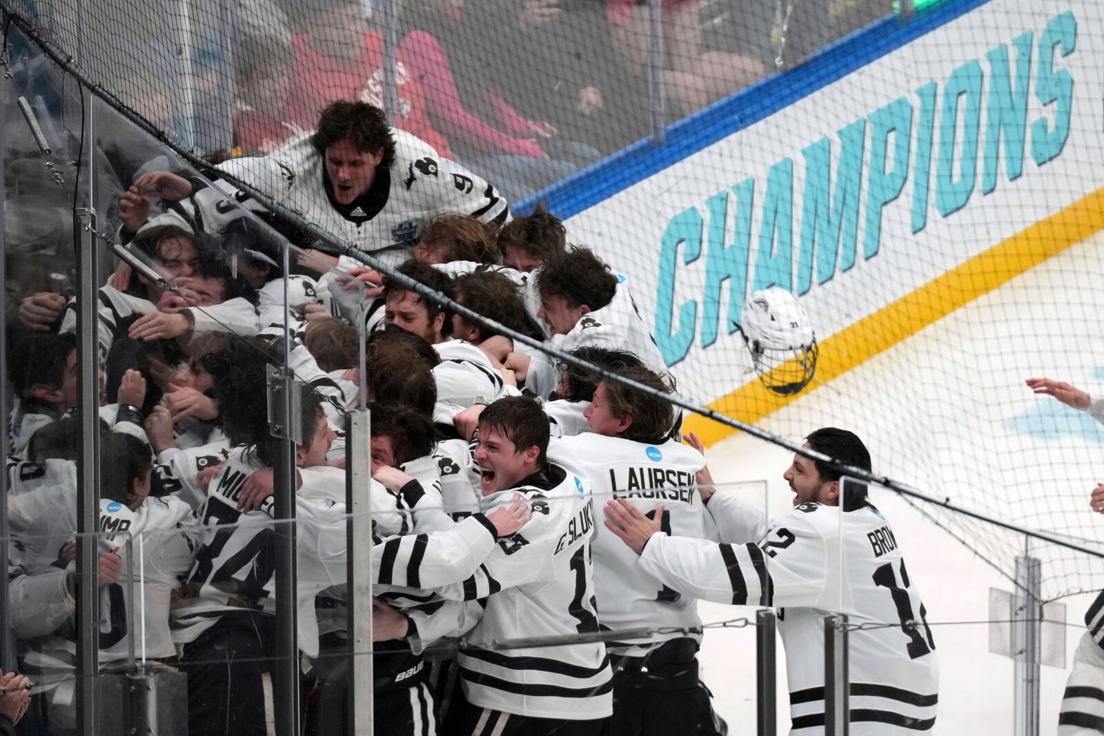 Members of Western Michigan celebrate after defeating Boston University in the championship game of the NCAA Frozen Four men's college hockey tournament, Saturday, April 12, 2025, in St. Louis (AP Photo/Jeff Roberson)