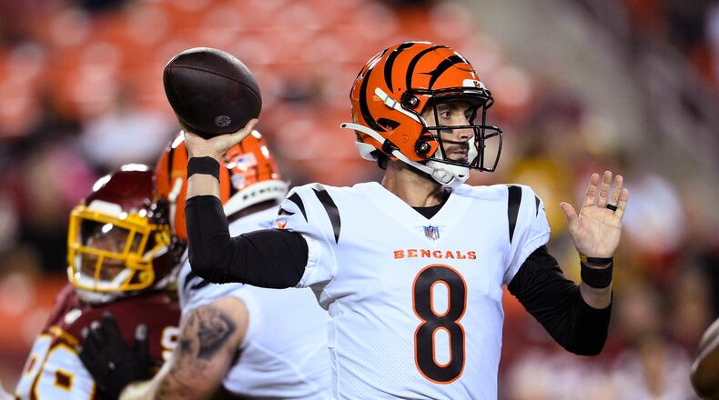 Cincinnati Bengals backup quarterback Brandon Allen (8) was placed on the Reserve/COVID list Monday. He is shown throwing a pass during the first half of the team's preseason NFL football game against the Washington Football Team, Aug. 20, 2021, in Landover, Maryland. (AP Photo/Nick Wass)