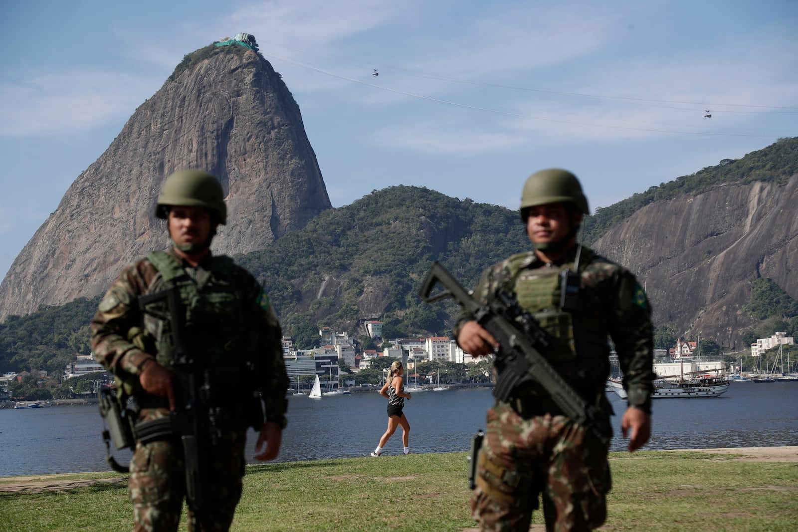 Soldiers patrol Flamengo Beach next to the Sugar Loaf mountain ahead of the 17th annual BRICS summit in Rio de Janeiro, Sunday, July 6, 2025. (AP Photo/Bruna Prado)