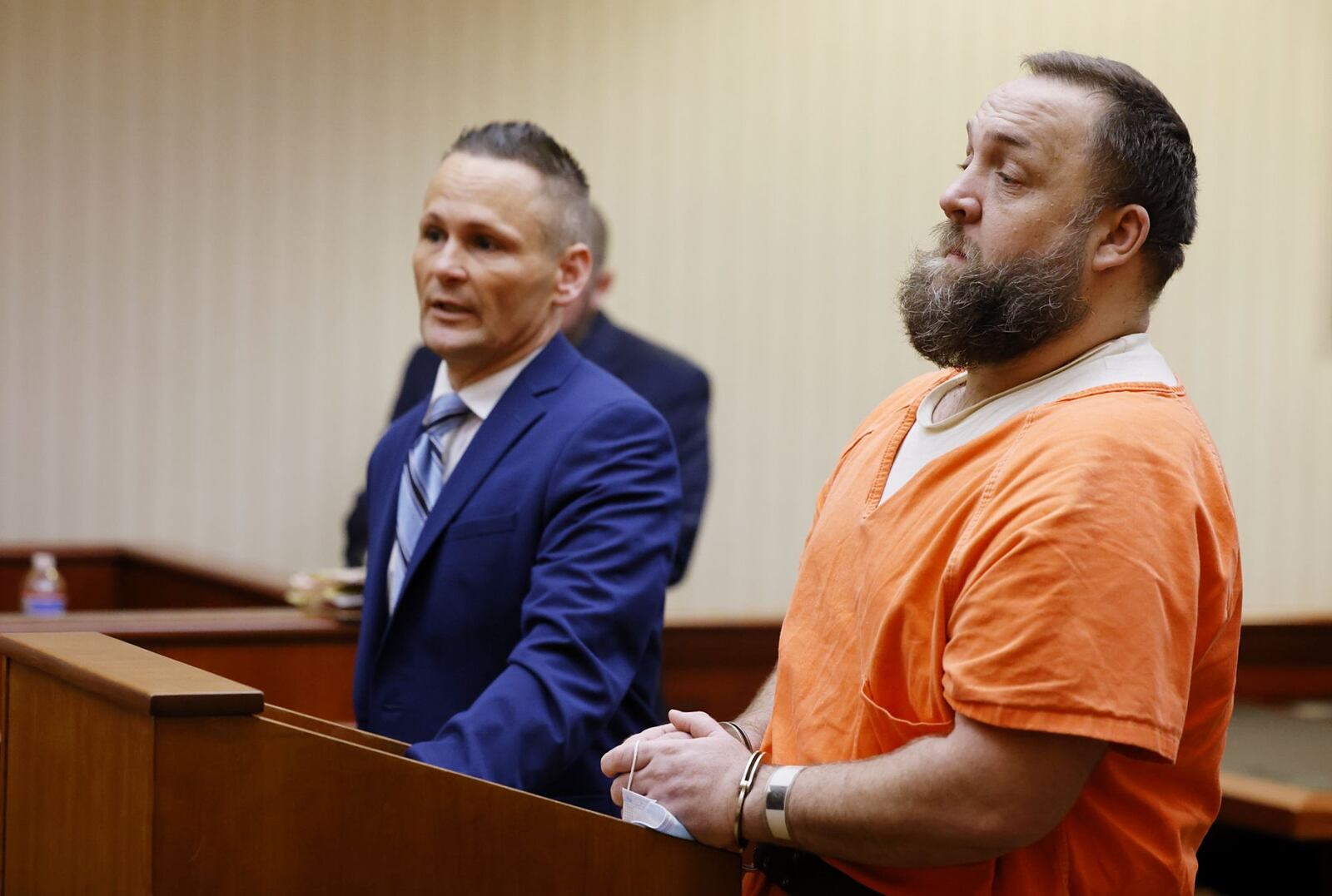 Michael Maloney, right, with attorney Ched Peck, appeared in Butler County Common Pleas Court for a hearing Wednesday, May 25, 2022 on charges in connection with pouring hot oil on a woman and child. NICK GRAHAM/STAFF