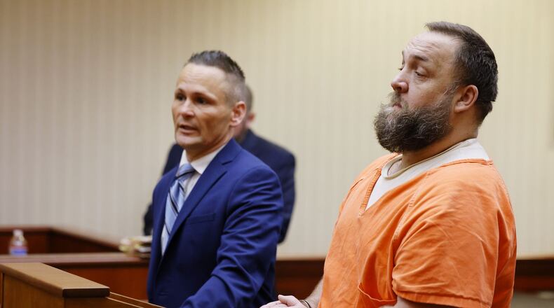 Michael Maloney, right, with attorney Ched Peck, appeared in Butler County Common Pleas Court for a hearing Wednesday, May 25, 2022 on charges in connection with pouring hot oil on a woman and child. NICK GRAHAM/STAFF