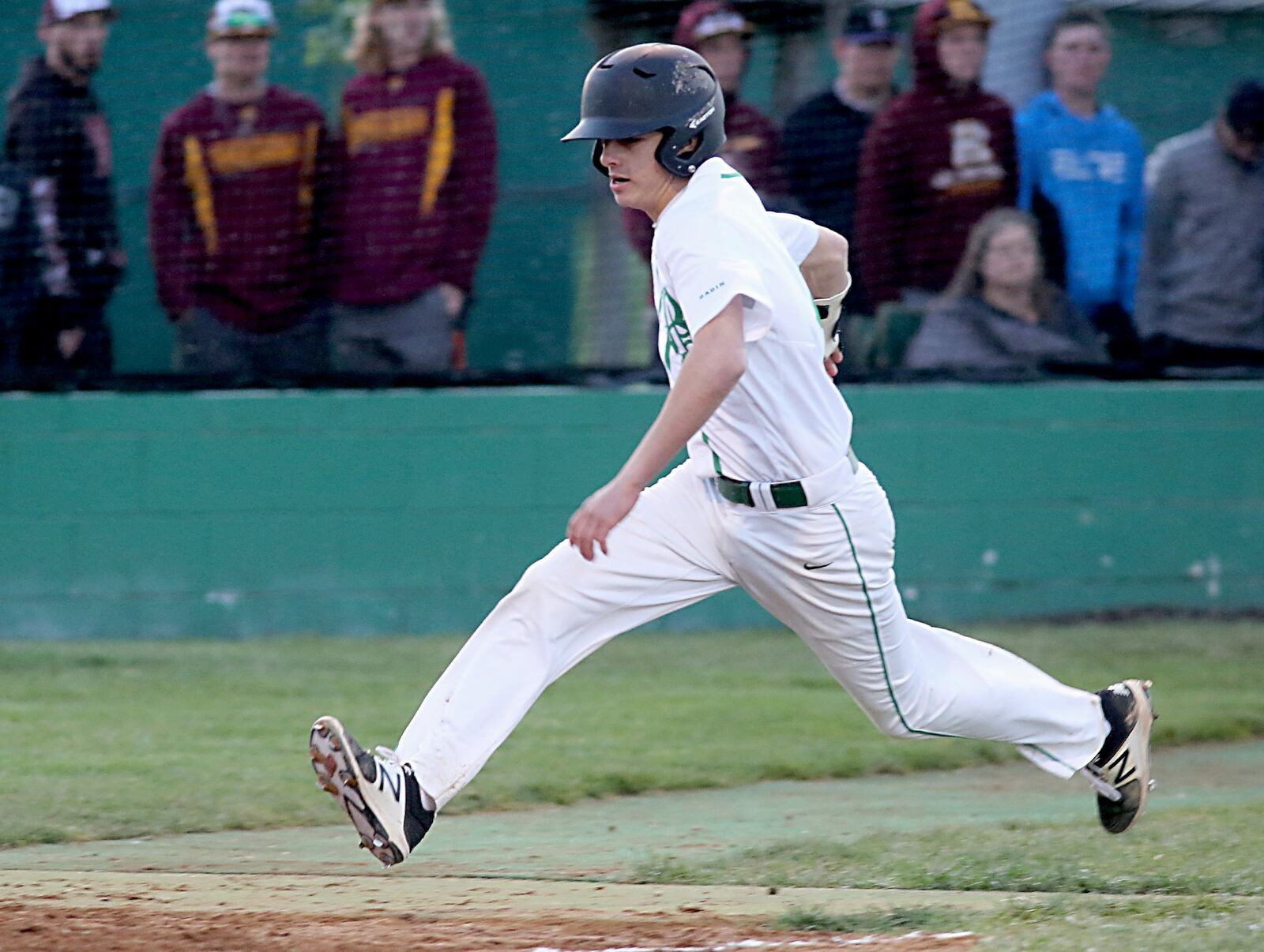 Jalen Stockelman heads home for Badin’s third and final run Saturday night during a game against Hamilton at Alumni Field in Hamilton. CONTRIBUTED PHOTO BY E.L. HUBBARD