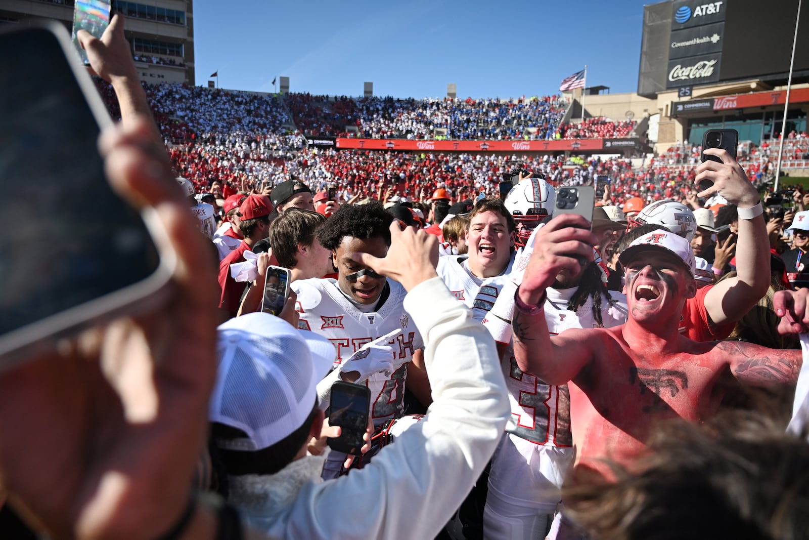 Texas Tech fans storm the field after the team's win over BYU in a NCAA college football game, Saturday, Nov. 8, 2025, in Lubbock, Texas. (AP Photo/Annie Rice)
