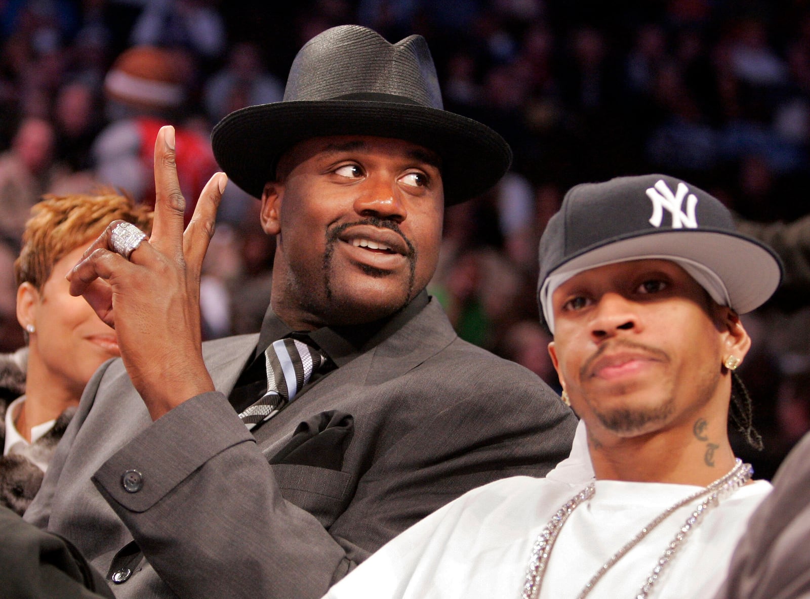 FILE - Miami Heat center Shaquille O'Neal, left, and Philadelphia 76ers guard Allen Iverson watch their teammates during the NBA Rookie Challenge on Feb. 18, 2005, at the Pepsi Center in Denver. (AP Photo/Mark Terrill, File)