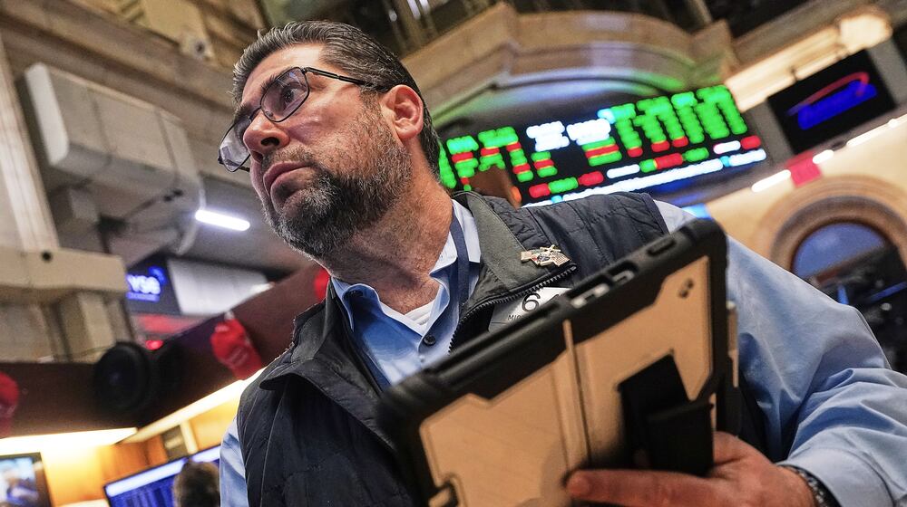 Trader Michael Capolino works on the floor of the New York Stock Exchange, Monday, Jan. 12, 2026. (AP Photo/Richard Drew)