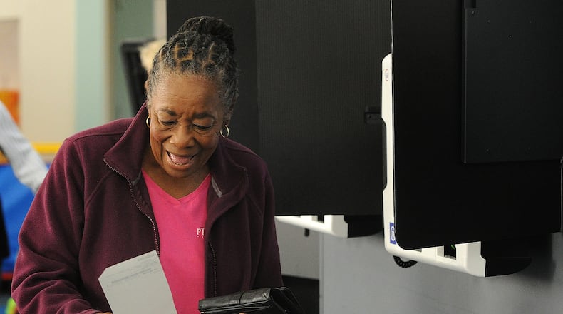 Gloria Payne, 79, casts her ballot on Tuesday Aug. 8 2023 at a Dayton-area polling location. She said she votes in every election because she remembers hearing from her mother about a time where every citizen couldn't vote. MARSHALL GORBY\STAFF