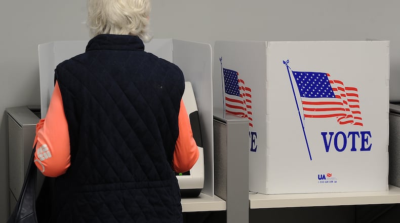 In this file photo a woman votes early at the Montgomery County Board of Elections Thursday Oct. 28, 2021. In May 2024 Ohio Secretary of State Frank LaRose announced he'll be removing the names of "inactive" voters from the state's voter registration rolls. MARSHALL GORBY\STAFF