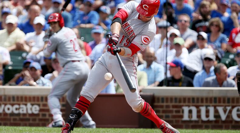 CHICAGO, IL - AUGUST 17: Joey Votto #19 of the Cincinnati Reds hits a home run in the second inning against the Chicago Cubs at Wrigley Field on August 17, 2017 in Chicago, Illinois. (Photo by Dylan Buell/Getty Images)