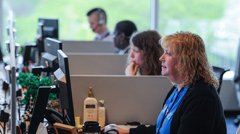 Lula Shumard and others take calls at Barclaycard’s facility inside Vora Technology Park in Hamilton. Barclaycard is one of several Butler County businesses that added to the more than 161,000 jobs created in October nationwide, a month in which the unemployment rate fell slightly to 4.9 percent. NICK GRAHAM/STAFF