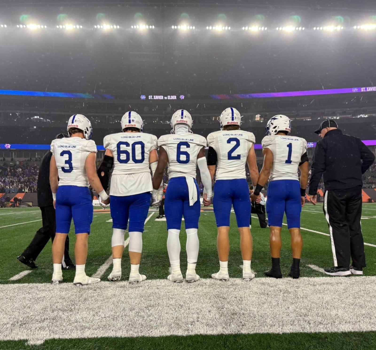 St. Xavier football players prepare to take the field before their game against Elder last Friday at Paycor Stadium. ST. XAVIER ATHLETICS PHOTO