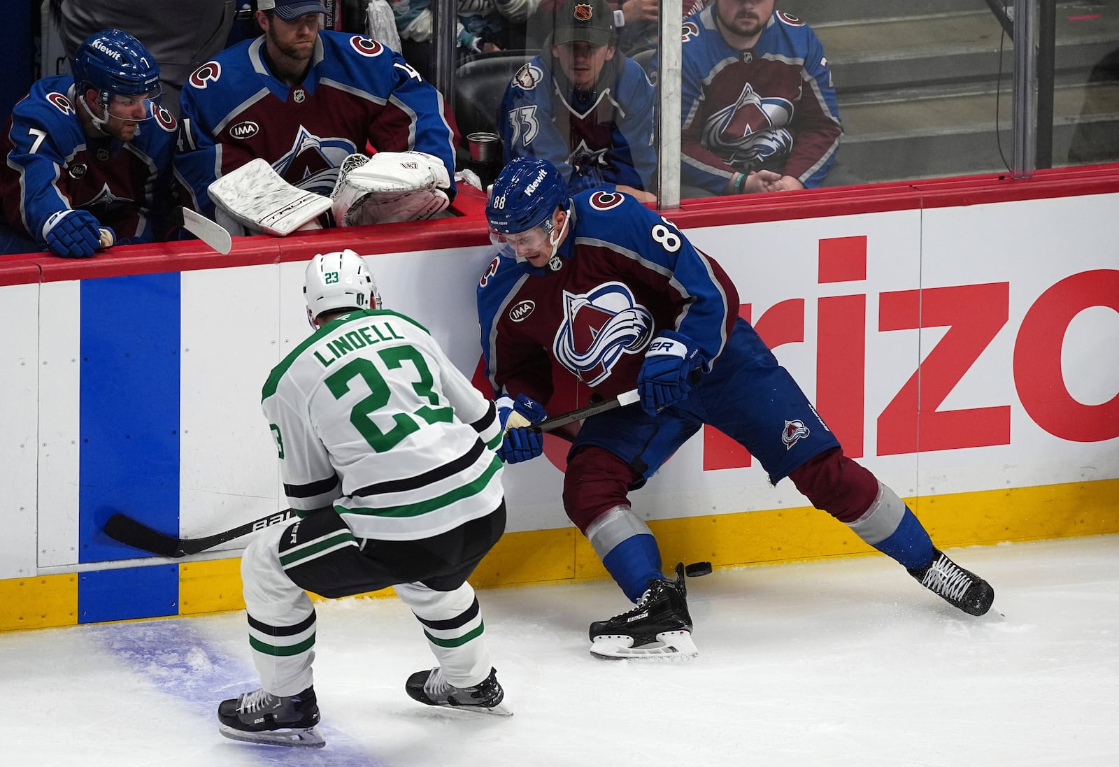 Colorado Avalanche center Martin Necas, right, loses control of the puck as Dallas Stars defenseman Esa Lindell covers in the first period of Game 3 of an NHL hockey first-round playoff series Wednesday, April 23, 2025, in Denver. (AP Photo/David Zalubowski)