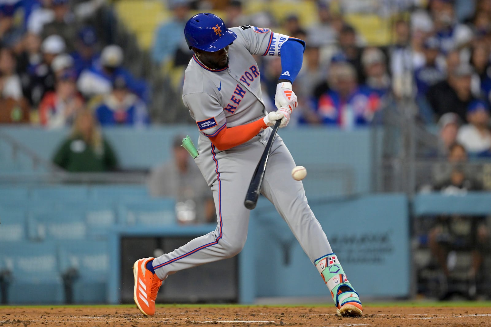 New York Mets' Ronny Mauricio grounds into a double play during the second inning of a baseball game against the Los Angeles Dodgers, Tuesday, June 3, 2025, in Los Angeles. (AP Photo/Jayne Kamin-Oncea)