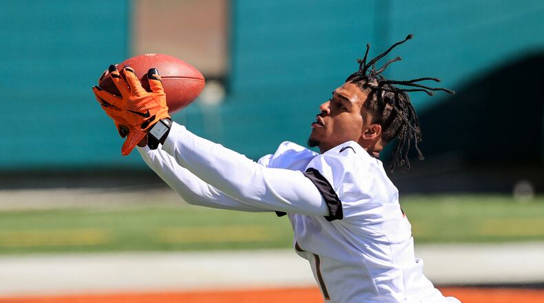 Cincinnati Bengals wide receiver Ja'Marr Chase makes a catch during an NFL football rookie minicamp in Cincinnati, Friday, May 14, 2021. (AP Photo/Aaron Doster)