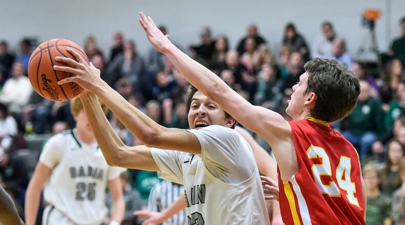 Fenwick’s David Luers defends Badin’s Caleb Meyer on Jan. 19 at Mulcahey Gym in Hamilton. Fenwick posted a 61-56 victory in overtime. NICK GRAHAM/STAFF