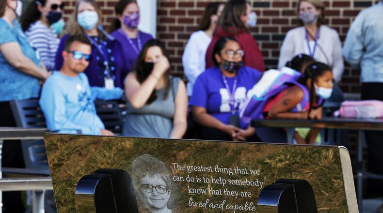 A dedication was held Thursday, Sept. 9, 2021 at Rosa Parks Elementary School in Middletown for a black granite bench in memory of James Hutchinson who was killed by his mother. Hutchinson was a student at Rosa Parks Elementary. NICK GRAHAM / STAFF