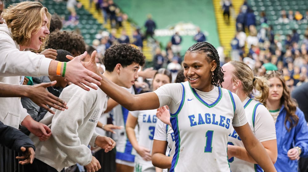 Chaminade-Julienne freshman guard Ja'Kyiah Cook shakes hands with fans following a 62-57 win over Copley in a Division III state semifinal on Thursday, March 12 at Ervin J. Nutter Center in Fairborn. Cook led the squad with 16 points and had eight rebounds, four assists and four steals. BRYANT BILLING / STAFF