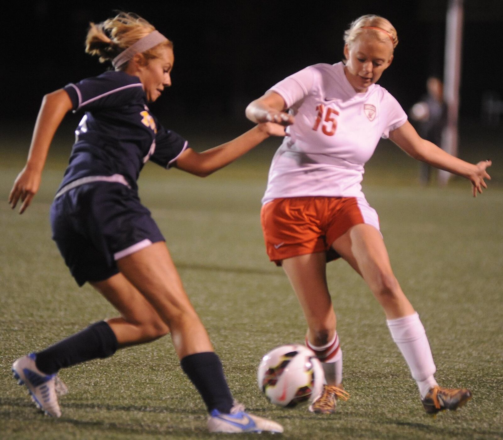 Monroe’s Regan Snyder (left) battles Meredith Brumfield of Tippecanoe for control of the ball during a Division II regional semifinal at Wright State University on Oct. 28, 2014. Tippecanoe won 1-0. MARC PENDLETON/STAFF