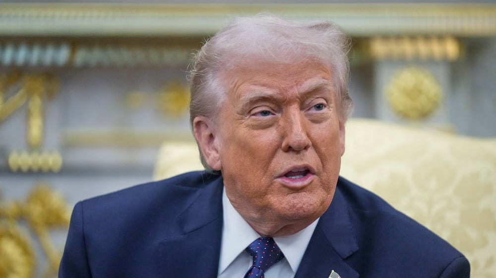 FILE - President Donald Trump speaks during a meeting with German Chancellor Friedrich Merz in the Oval Office at the White House, Tuesday, March 3, 2026, in Washington. (AP Photo/Mark Schiefelbein, File)