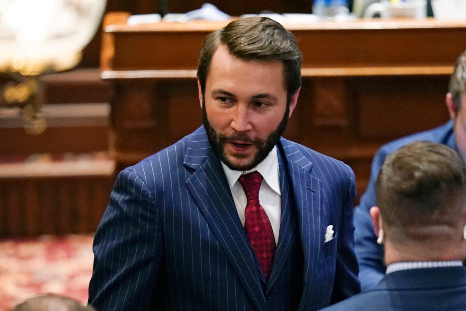 FILE - State Rep. Bobby Kaufmann, R-Wilton, left, walks through the Iowa Senate chamber, Feb. 24, 2021, at the Statehouse in Des Moines, Iowa. (AP Photo/Charlie Neibergall, File)