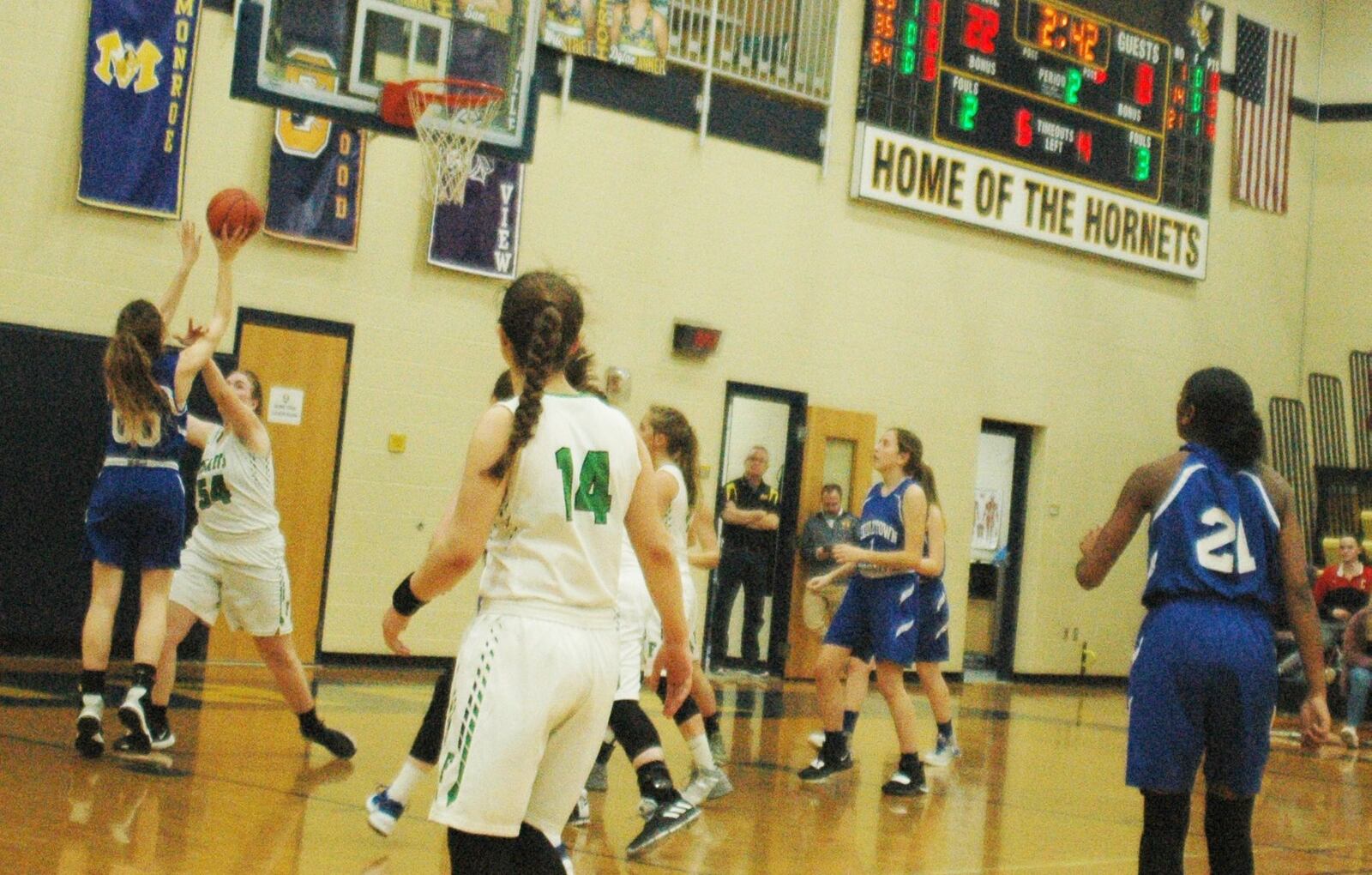 Middletown Christian’s Anna Crawford (00) shoots over Kelbee Coffman (54) of Fayetteville-Perry during Wednesday night’s Division IV sectional game at Monroe. Fayetteville won 55-13. RICK CASSANO/STAFF