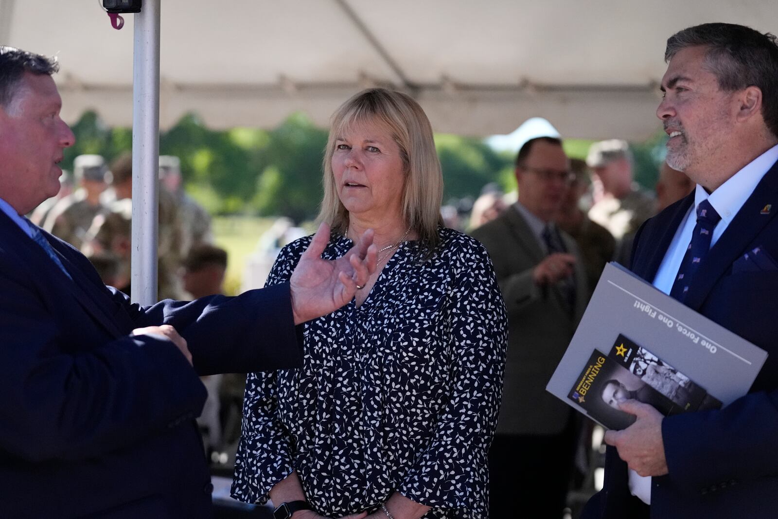 Ms. Sue Conger-Williams, center, Fred Benning's granddaughter joined Army military officials during a ceremony at Fort Benning, honoring new namesake on Wednesday, April 16, 2025, in Fort Benning, Ga. (AP Photo/Brynn Anderson)