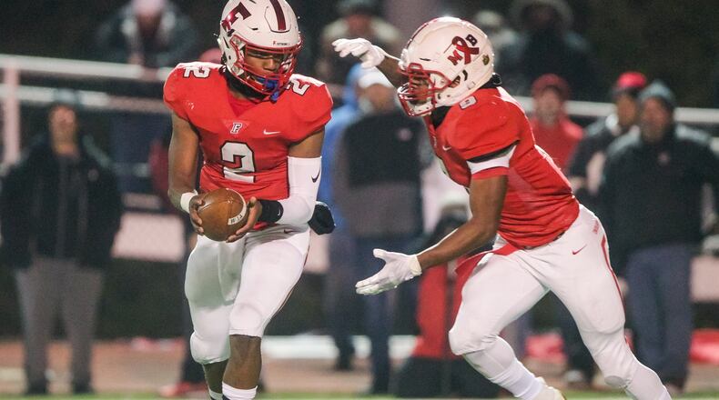 Fairfield quarterback Sawaiha Ellis (2) hands the ball off to running back Jutahn McClain during their Division I regional semifinal football playoff game against Colerain Friday, Nov. 15, 2019 at Princeton’s Pat Mancuso Field. Colerain won 28-7. NICK GRAHAM/STAFF
