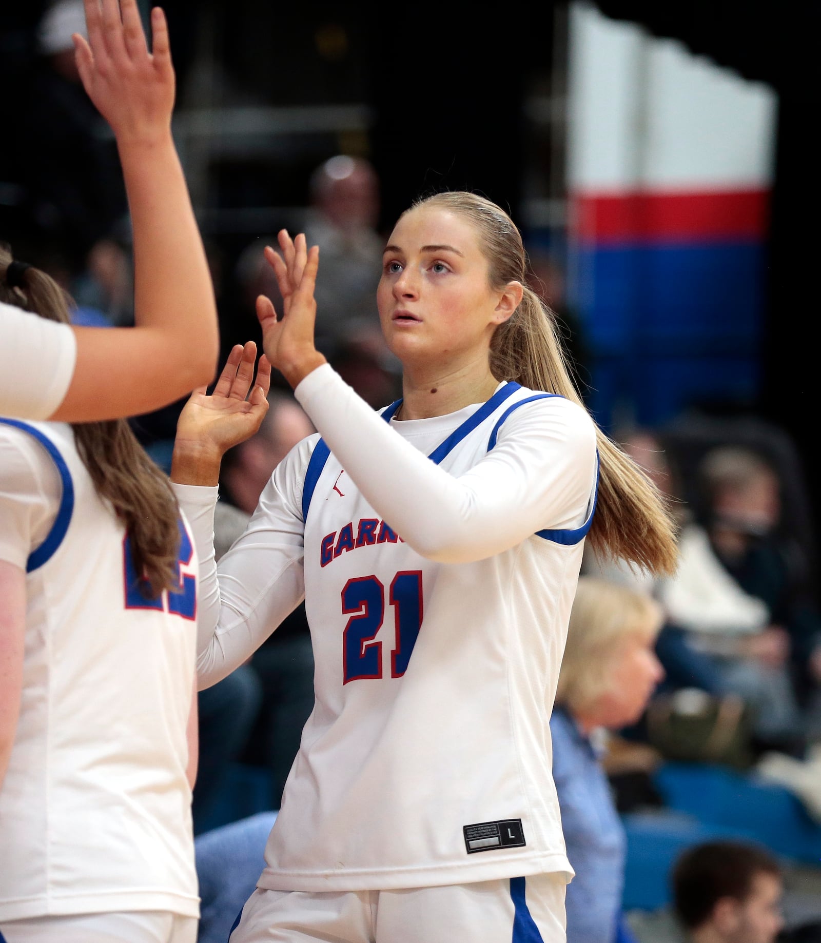 Carroll senior Kiera Healy is congratulated by teammates as she comes off the floor at the end of her final home game. Carroll defeated McNicholas 61-38 in a Greater Catholic League Co-Ed game on Saturday, Jan. 31, 2026. STEVEN WRIGHT / STAFF