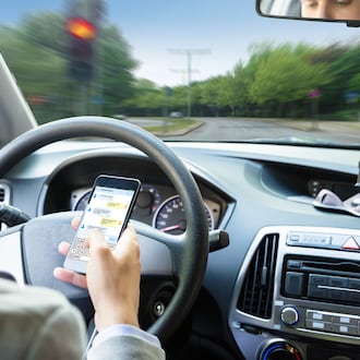 While it's illegal to use a phone while driving in Ohio, many are still looking at it at stoplights and while waiting on trains. ISTOCK
